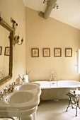 Pale bathroom with double sink and bathtub