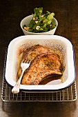 Pork chops with caraway and green salad