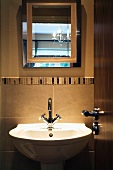 View of sink and mirror through open door