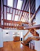 Converted, double height attic with rustic staircase