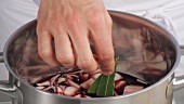 Adding a bay leaf to red wine marinade