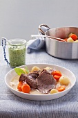 Boiled fillet of veal with vegetables and herb sauce