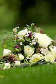 Bridal bouquet lying on lawn