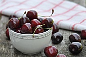 Cherries in bowl & on table