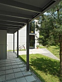 Roofed, flagged porch area of a modern building