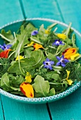 Rocket salad with edible flowers
