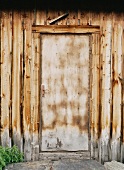 Old wooden door of a wooden house