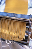 Pasta machine with freshly sliced spaghetti