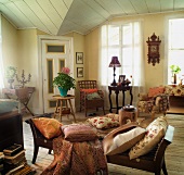 Pillows on chaise lounge in the living room of a country home