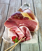 Cut, air-cured ham and grissini