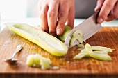 A deseeded cucumber being sliced