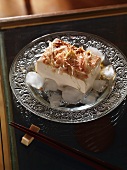 Silken tofu on ice with dried bonito flakes, ginger and spring onions (Japan)