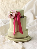 Wedding cake with a bow and flowers