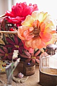 Overblown roses in basket and heart-shaped, brass pillbox