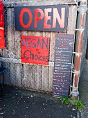 Menu board for a vegan food at a Farmer's Market in Portland, Oregon