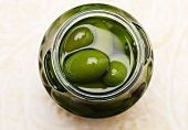 An Open Jar of Green Olives; From Above