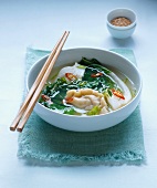 Soup with wontons, pak choi and chilli