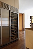 Contemporary kitchen with stainless steel combined wine cabinet and refrigerator