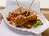Pork skewers with tomato and caper salsa