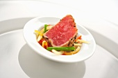 Tuna with black pepper and mixed vegetable salad