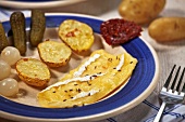 Platter of Swiss raclette and pickled vegetables