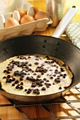 Blueberry pancake in pan
