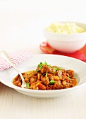 Sausages with borlotti beans and mashed potato