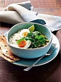 Lentil curry with egg, chick peas, spinach and rice