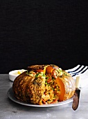 Pumpkin stuffed with paella