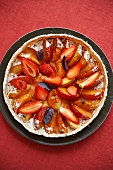 Peach and apricot tart with strawberries (seen from above)