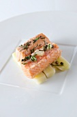 Salmon fillet with capers and lemons on a bed of leek