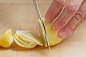 Finely slicing a lemon
