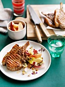 Grilled pork cutlets with peach-chicory salad