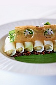 Cannelloni with herbs on a bed of lentils and spinach