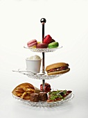 A cake stand of unhealthy food