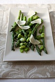 Asparagus and Broad Bean Salad with Shaved Cheese on a Platter