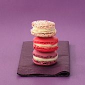 Three macarons on a serviette (stacked)