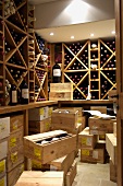 A wine rack and a stack of wooden boxes in a well-stocked wine cellar