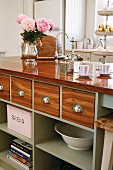 Pastel green kitchen counter with spacious drawers and shelves