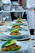 Salmon dishes in a commercial kitchen