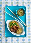 Grilled pork chop with apple sauce and vegetable strips