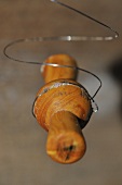 A wooden reel with a wire for cutting cheese