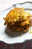 A stack of potato rösti (hash browns) on a plate
