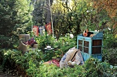 Garden decorated with flags, armchair and cabinet