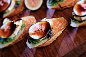 Appetizers of French Bread Slices Topped with Le Brin Brie Cheese, Fig and Balsamic Glaze