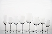 A row of empty wine glasses