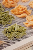 Pasta nests drying on a rack