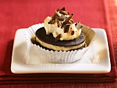 Cream Filled Chocolate Cookie with Chocolate Shavings; In a Foil Muffin Cup
