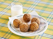 Sugar Donut Holes with a Glass of Milk