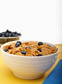 Bowl of Wheat Flake Cereal with Blueberries; Bowl of Blueberries